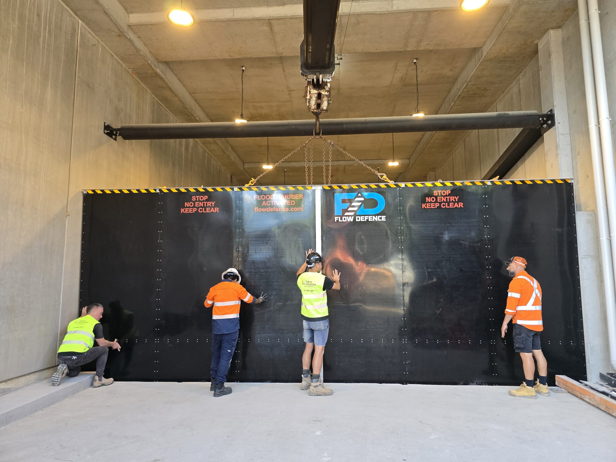 automatic flood barrier installed at basement ramp in Northmead NSW to prevent water entering industrial building